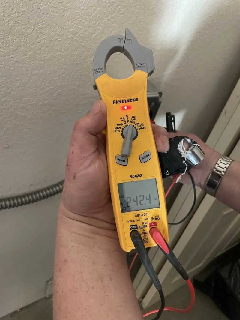Voltage testing with clamp meter during Electrical Installation Services in Solon